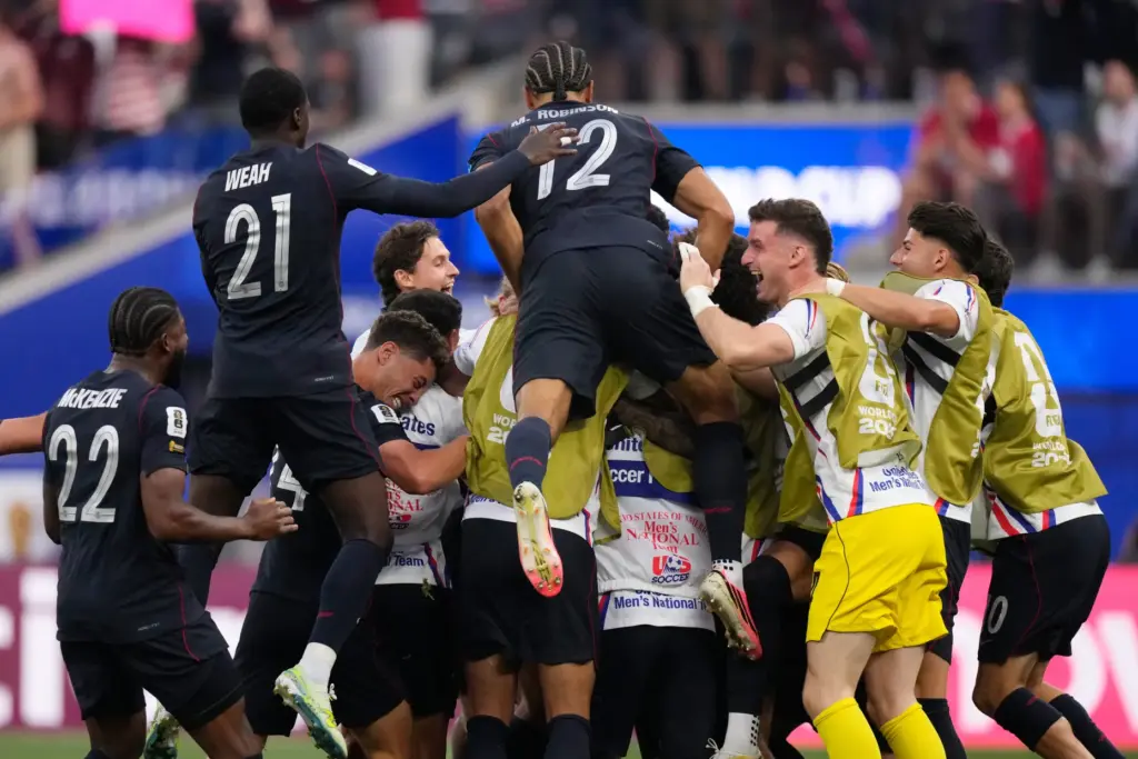 United States players celebrate after Auston Trusty scored their opening...