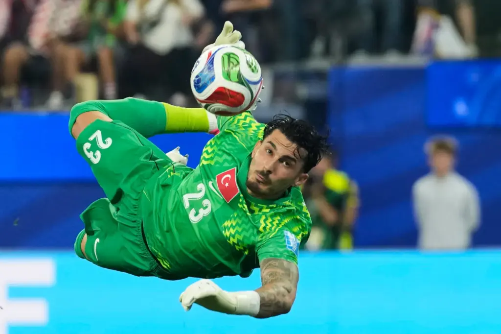 Turkey goalkeeper Ugurcan Cakir makes a save during the World...