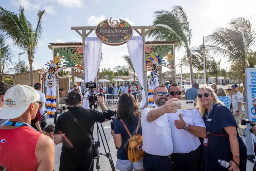 Carnival Sunrise Capt. Martino Pellegrini takes photos with other Carnival...