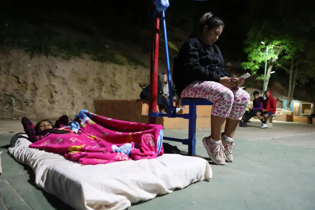 People camp on a sports court following an earthquake in Caracas, Venezuela.