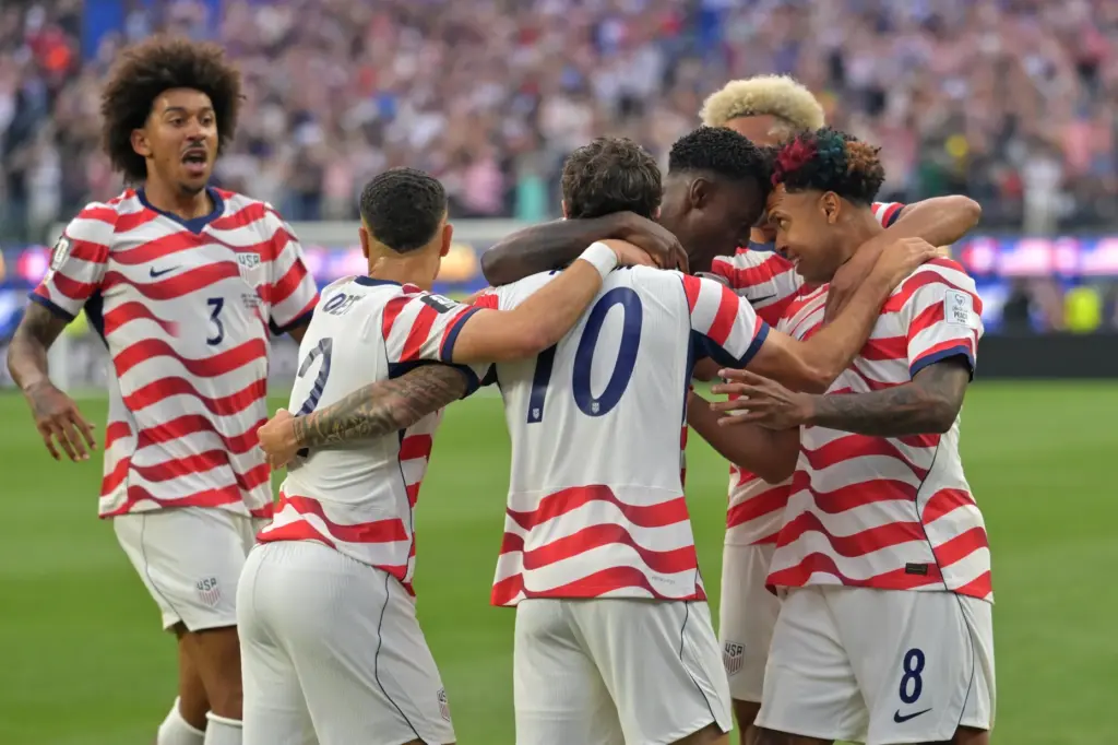 United States celebrates after an own goal by Paraguay’s Damian...