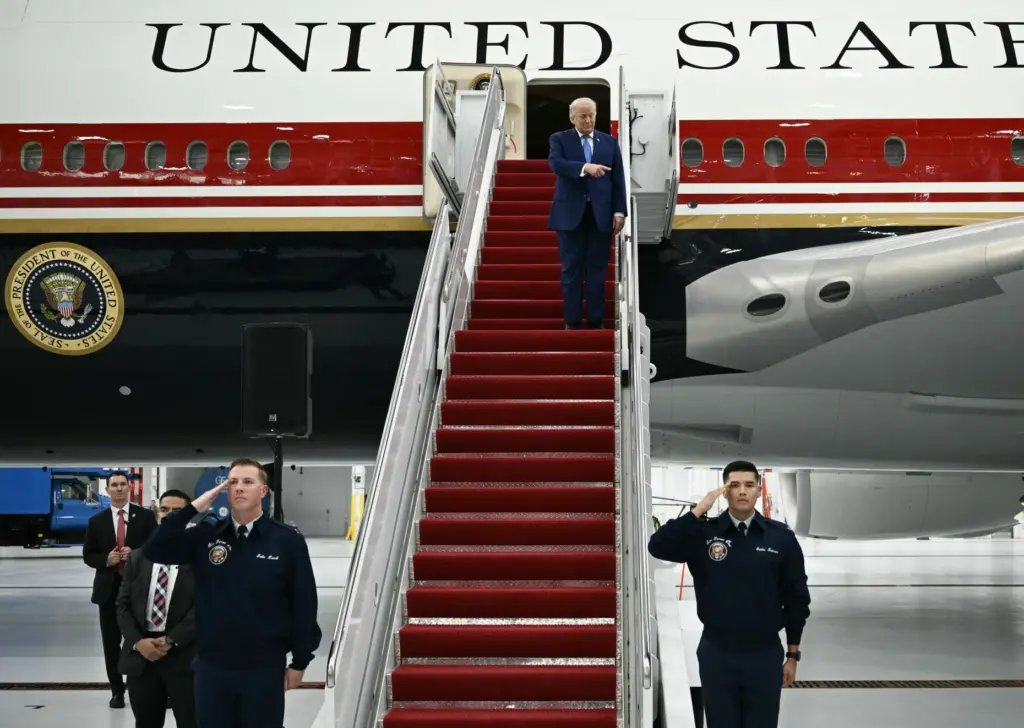 US President Donald Trump steps out of the new Air...