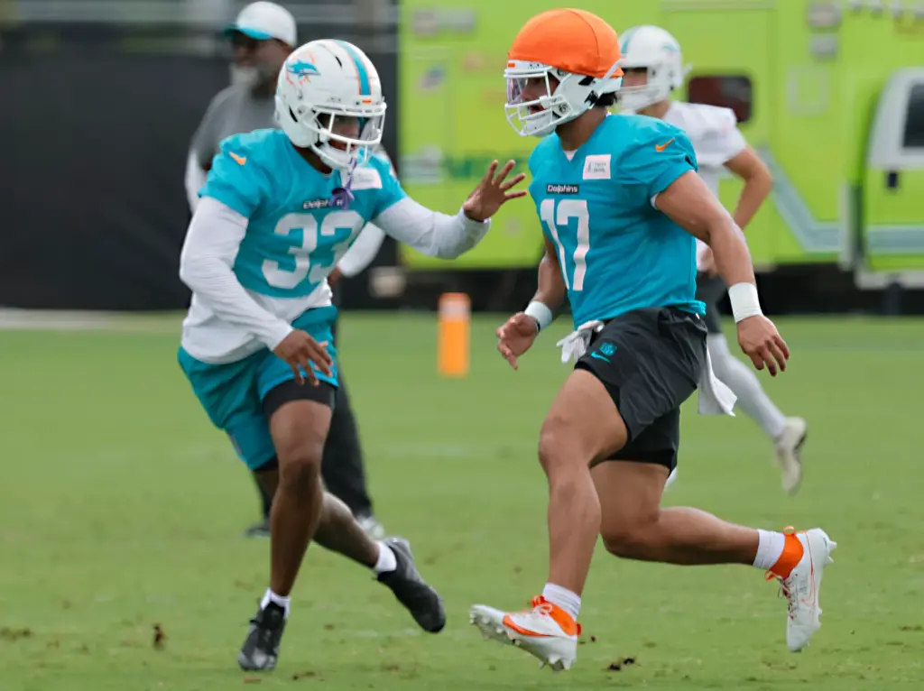 Miami Dolphins cornerback Jason Marshall Jr., left, and linebacker Trey...