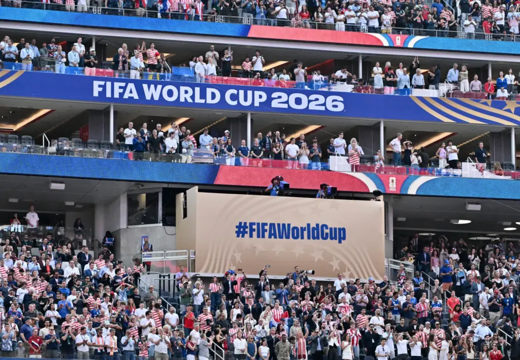 Fans look on during the national anthem prior to a...