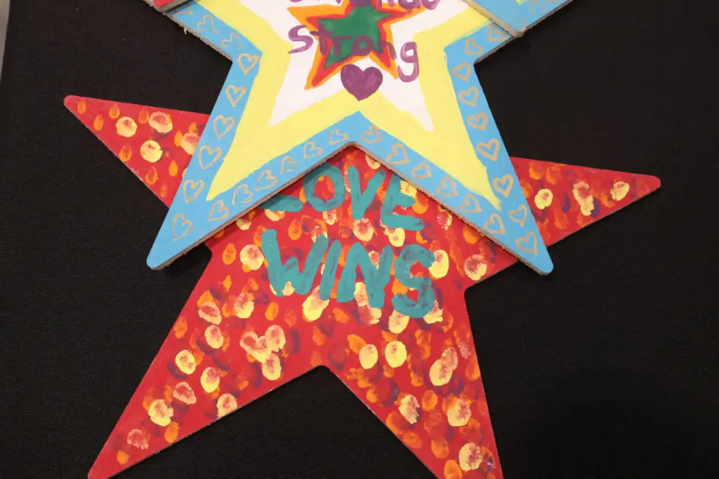 Painted star decorations with messages are among artifacts and items...