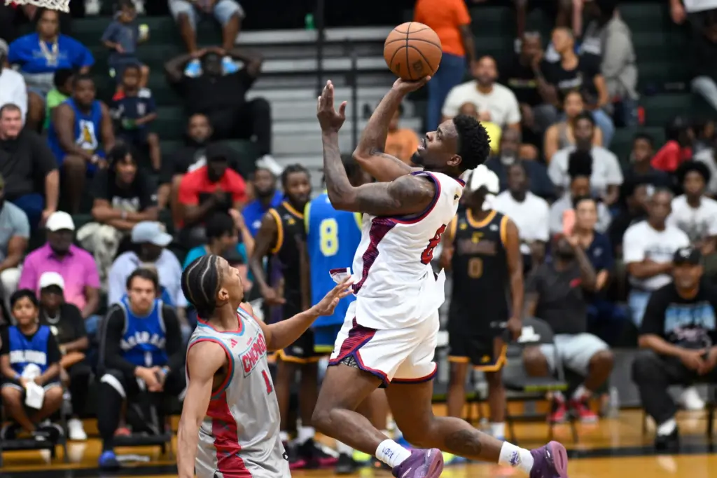 Team Atlantaâs Malik âBamBamâ Dunbar, right, goes up to shoot...