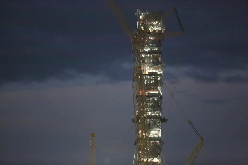 The mobile launcher 2 tower remains under construction adjacent the...