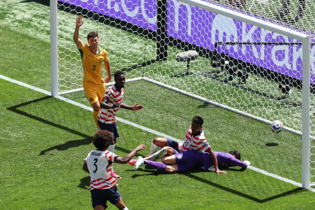 Australia’s Aiden O’Neill (13) appeals for offside after United States’...