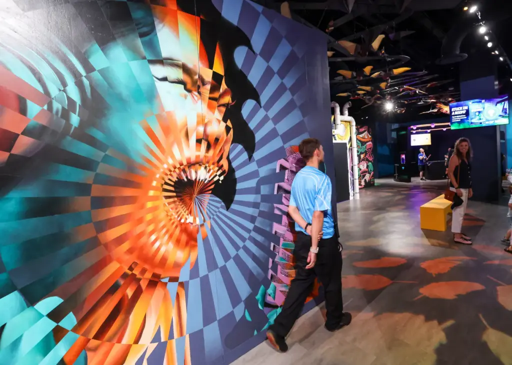Guests walk past âSawblade Sisterâ by Annapolis, Md., artist Jeff...