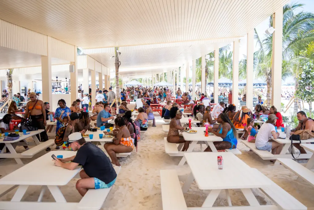 Guests eat outside of the Hibiscus Beach Grill at RelaxAway,...