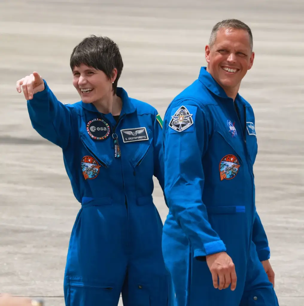 SpaceX Crew-4 astronauts Samantha Cristoforetti and Robert Hines wave during...