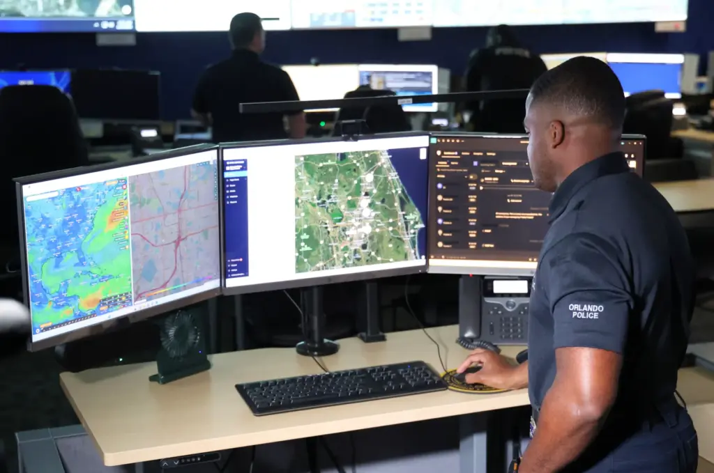 Orlando Police drone pilot Officer Todd Montford navigates from the...