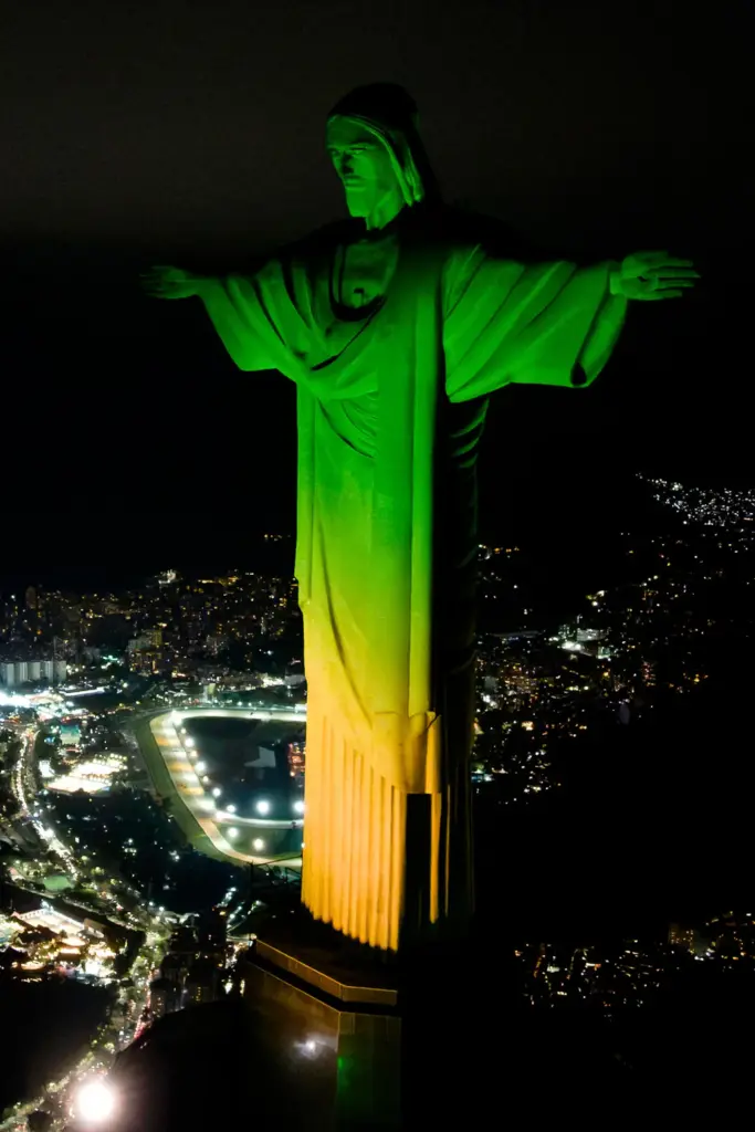 Christ the Redeemer monument is illuminated in Brazil’s national colors...