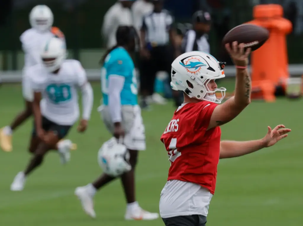 Miami Dolphins quarterback Quinn Ewers throws a pass during mandatory...