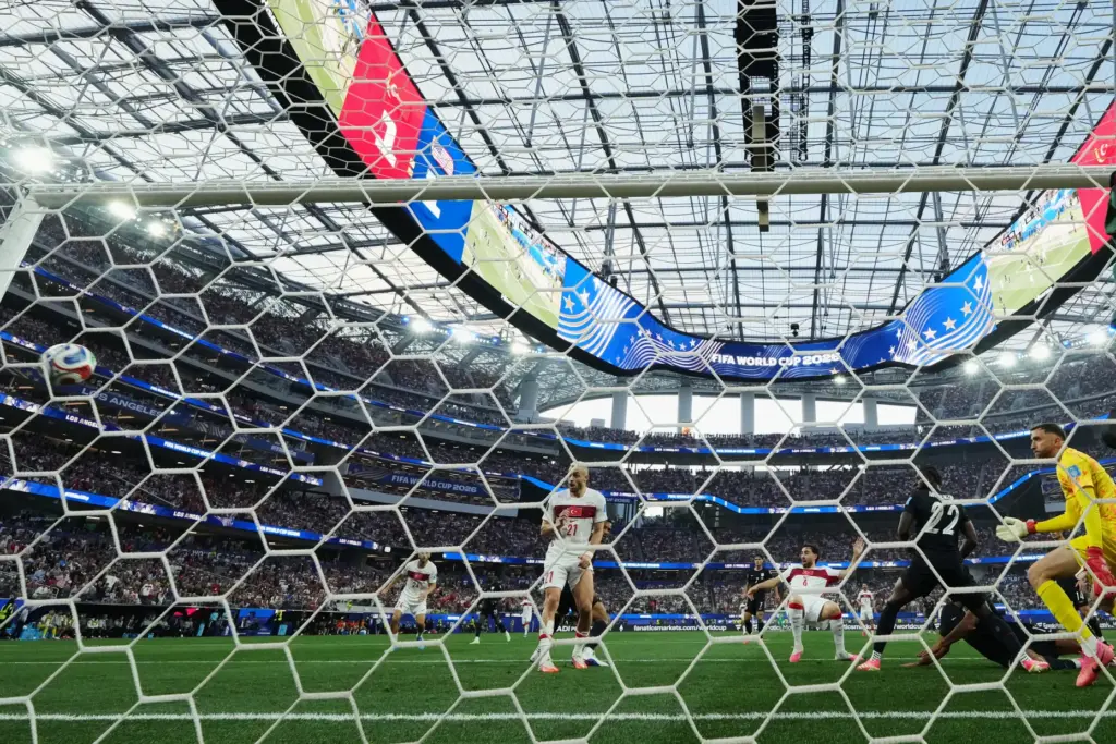 Turkey’s Orkun Kokcu (6) scores their second goal past United...