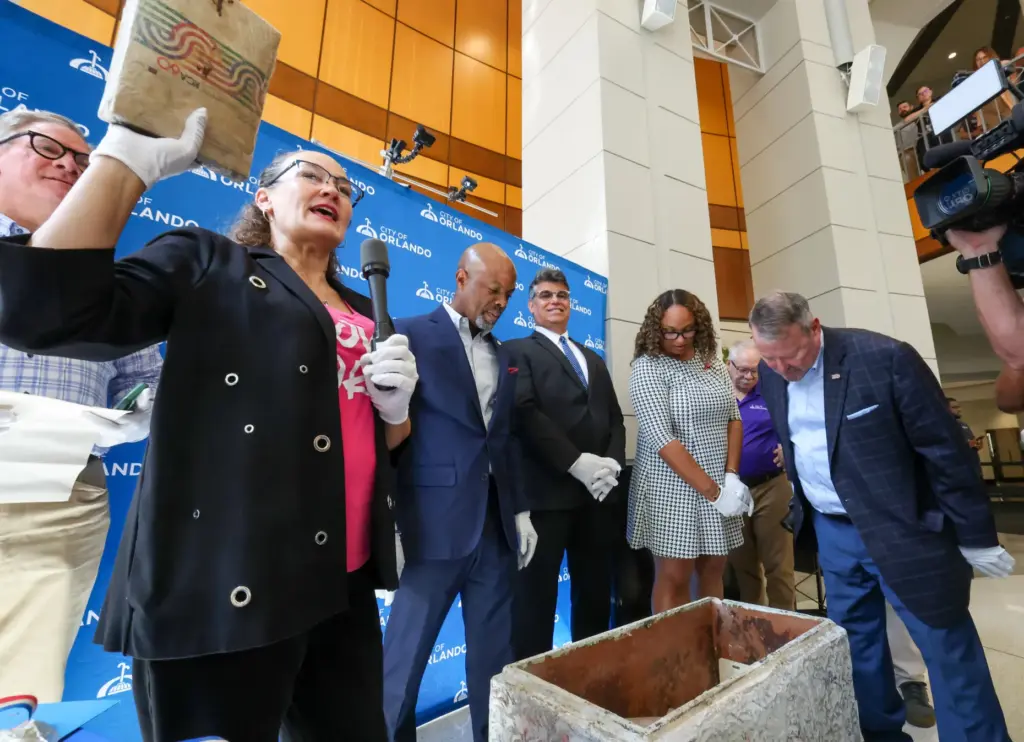 The City of Orlandoâs Tara Russakov retrieves an item during...