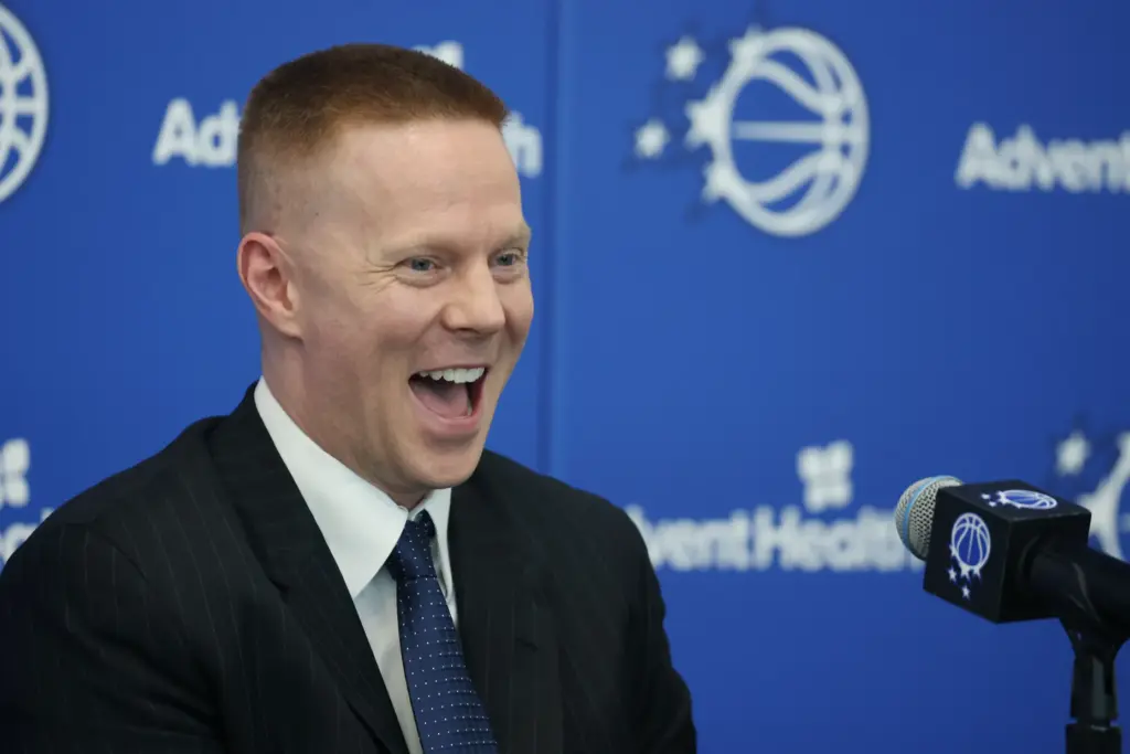 New Orlando Magic head coach Sean Sweeney laughs during a...