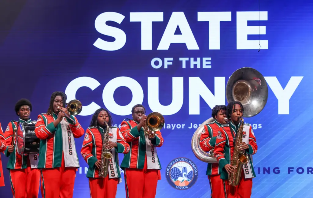 Members of the Jones High School marching band perform during...