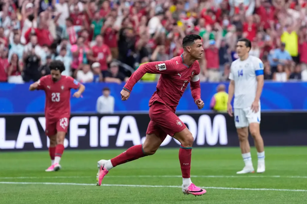 Portugal’s Cristiano Ronaldo celebrates after scoring the opening goal during...