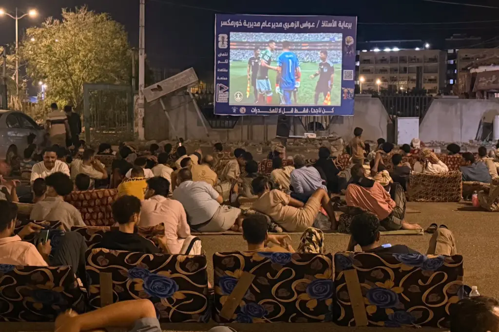 Fans gather to watch the first match of the World...