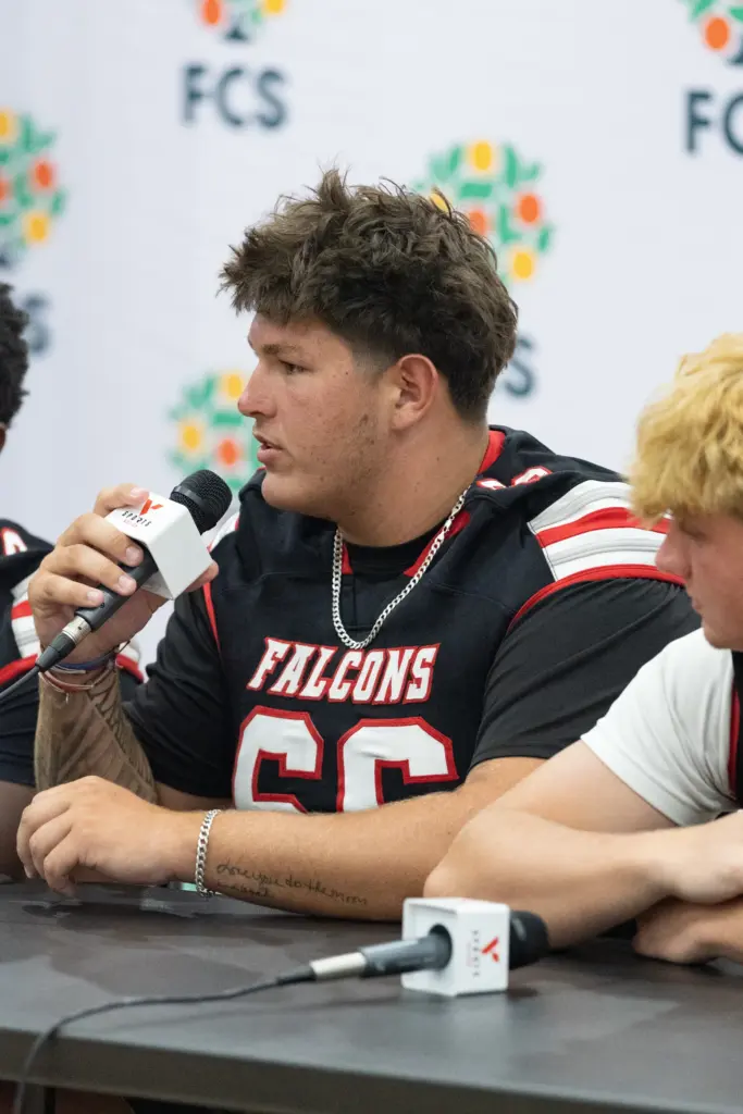 Player from East River High School answers questions during varsity...