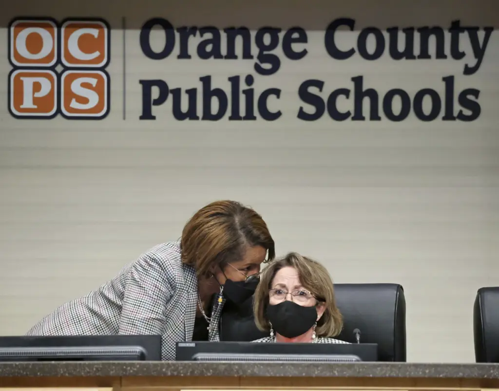 Orange County Public Schools Superintendent Barbara Jenkins, left, confers with...