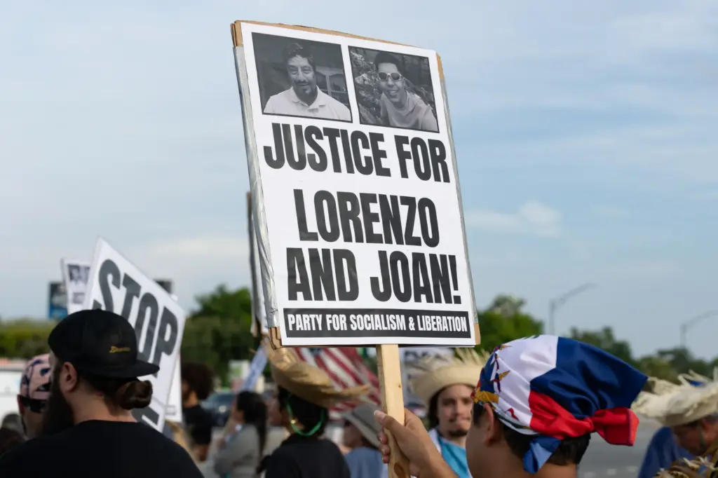Protester holds a sign during the Stop Ice Terror National...