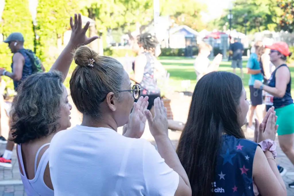Supporters cheer for the participants during the Watermelon 5K at...