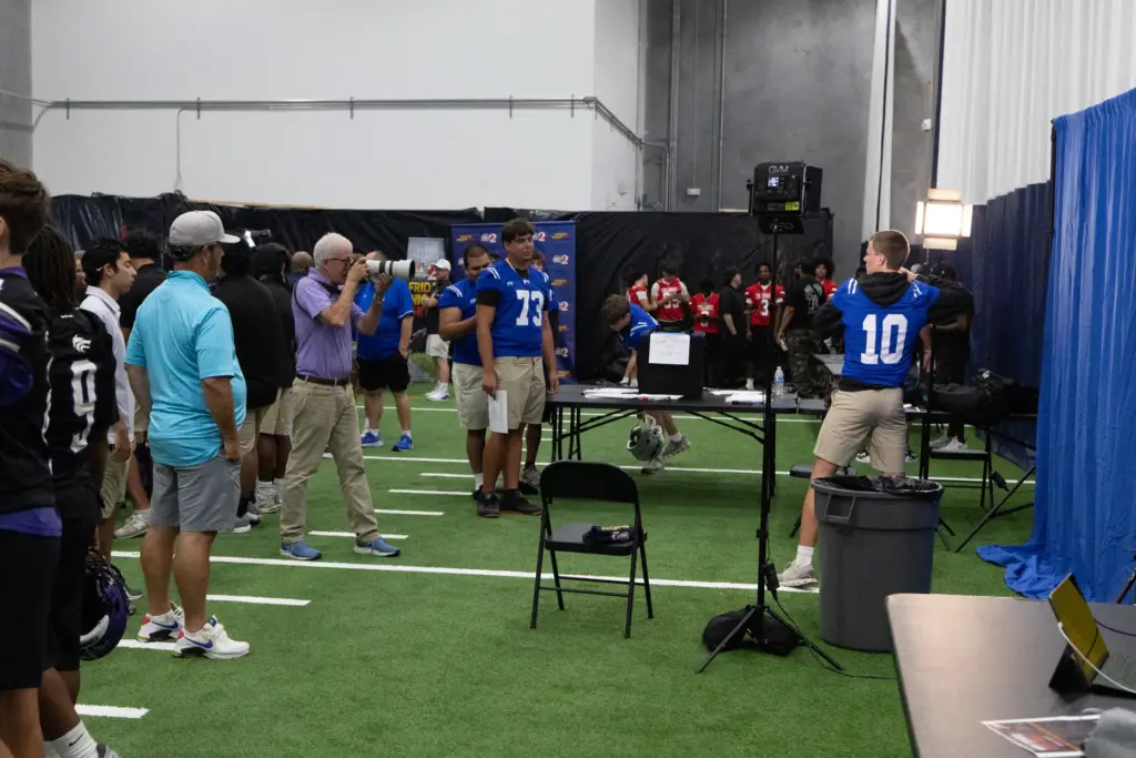 Teams line up to take pictures with Orlando Sentinel photographer...