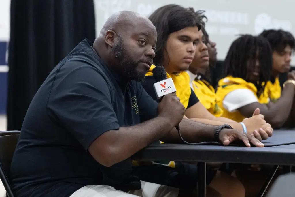 Oak Ridge High School coach Steven Reece answers questions during...
