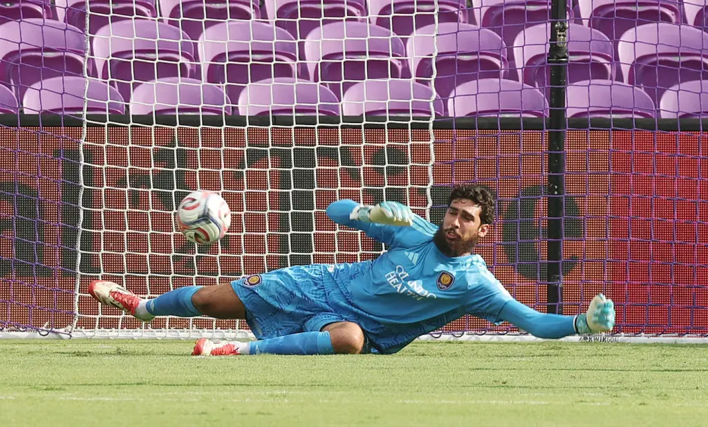 Orlando City goalkeeper Javier Otero makes a stop during the...