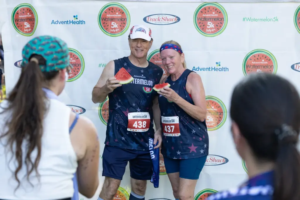 Runners pose for a photo after completing the Watermelon 5K...