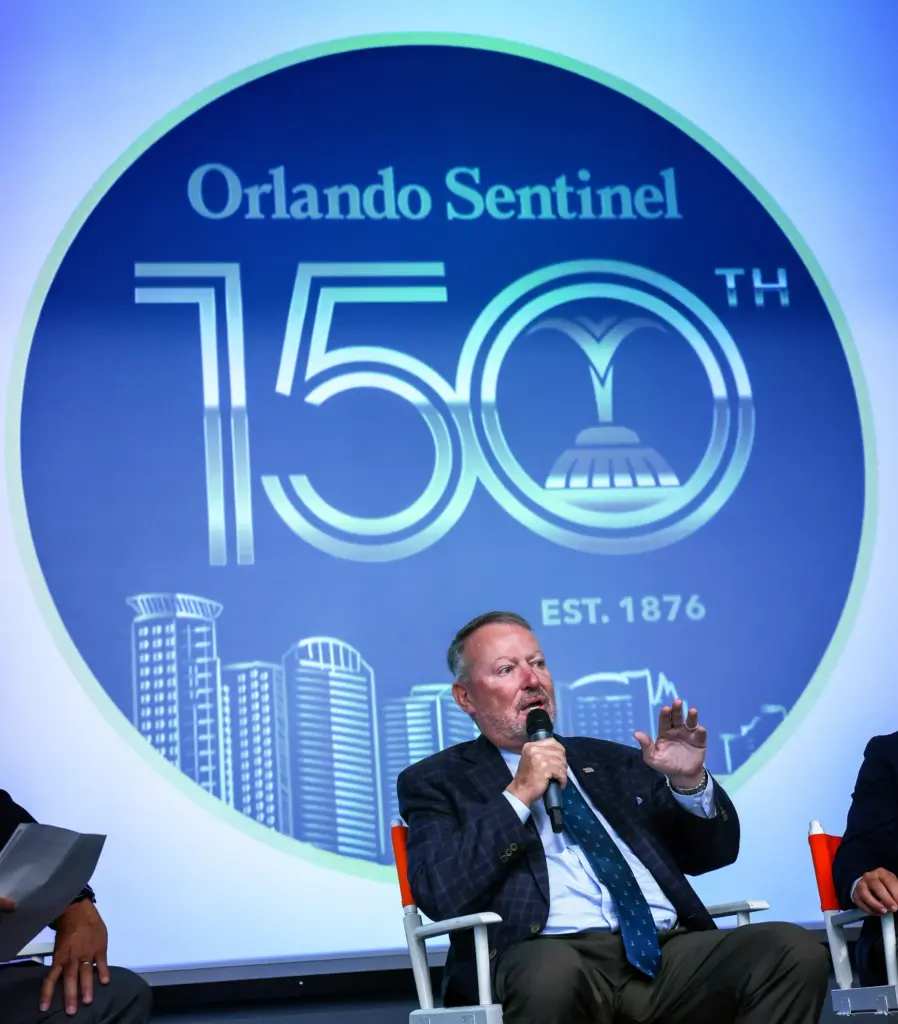 DISCUSSING DOWNTOWN â Orlando mayor Buddy Dyer answers a question...