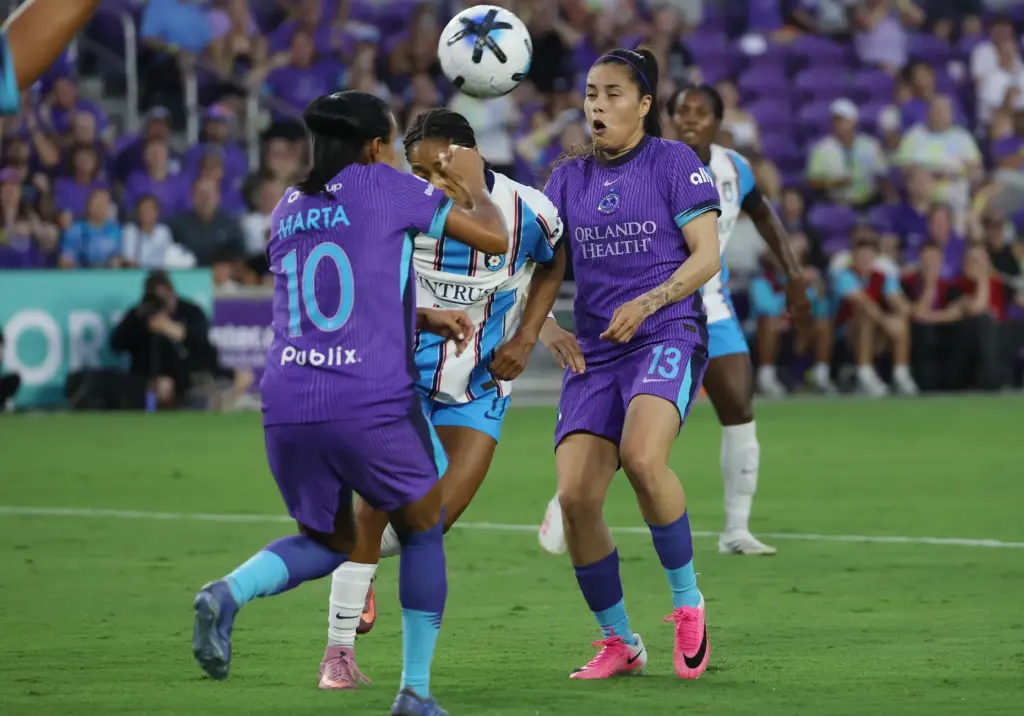 Orlando player Jacquie Ovalle (13) heads the ball toward teammate...