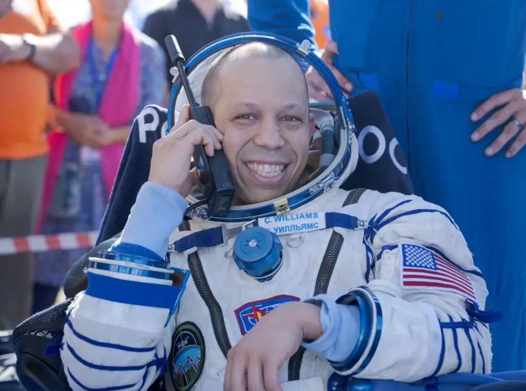 NASA astronaut Chris Williams is seen outside the Soyuz MS-28...