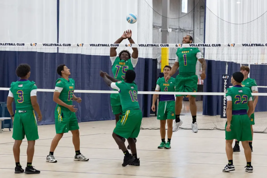 Players from DeLand High School play volleyball during varsity media...