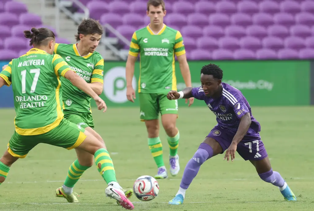 Orlando City player Ivan Angulo (77) battles for control during...