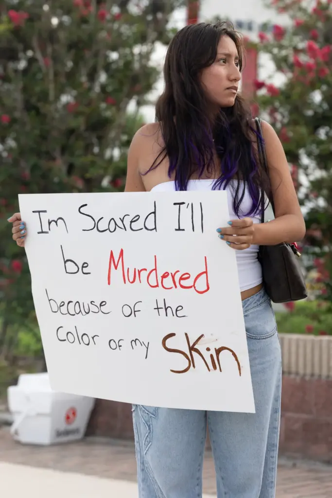 Protester holds a sign during the Stop Ice Terror National...