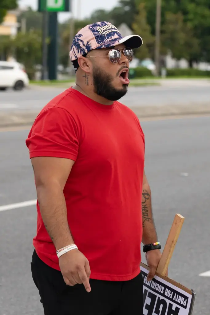 Protester leads the group chant during the Stop Ice Terror...