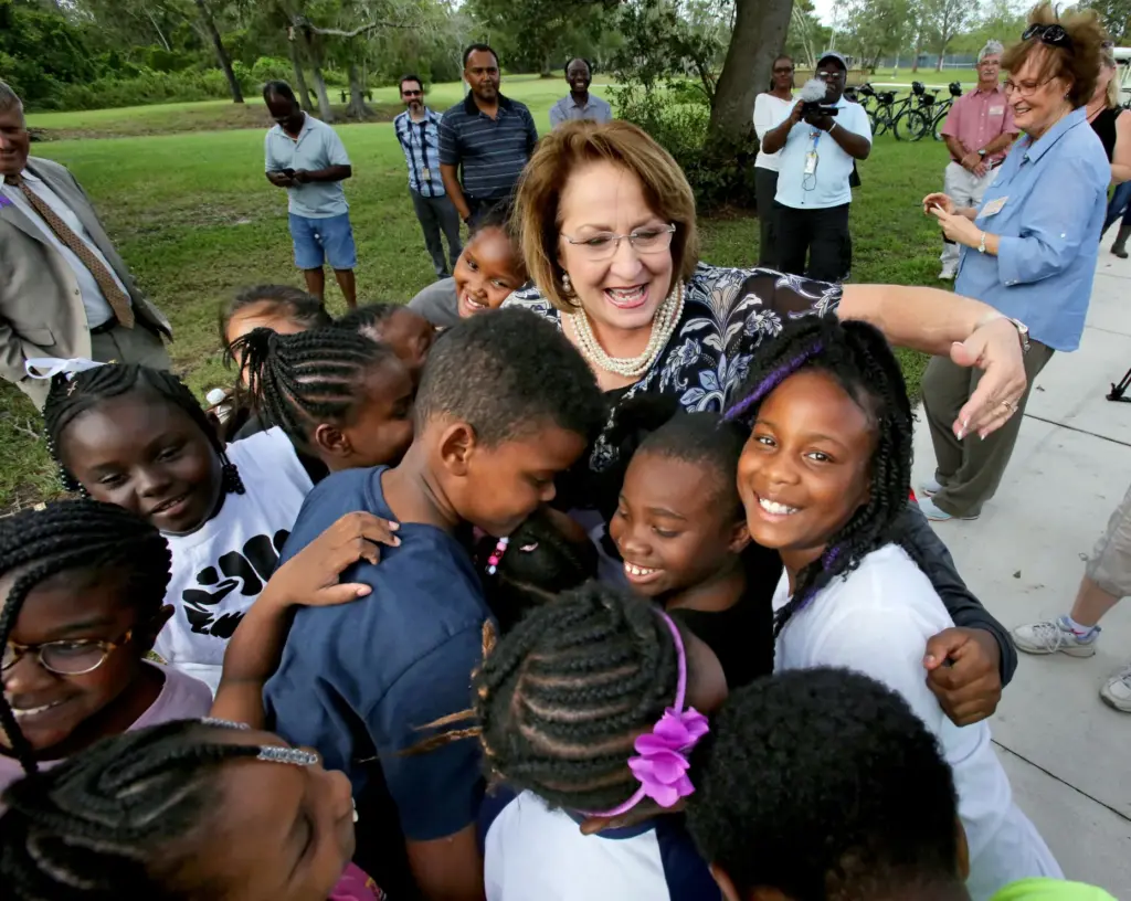 Orange County Mayor Teresa Jacobs gets a hug from students...