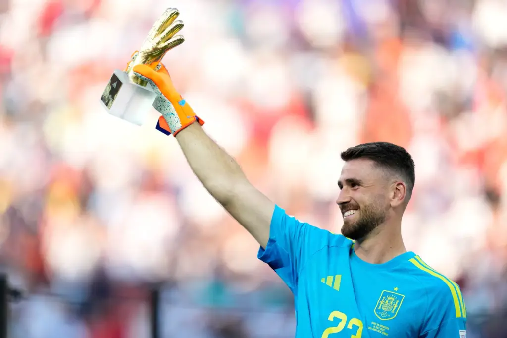 Spain goalkeeper Unai Simon poses with the tournament’s best goalkeeper...