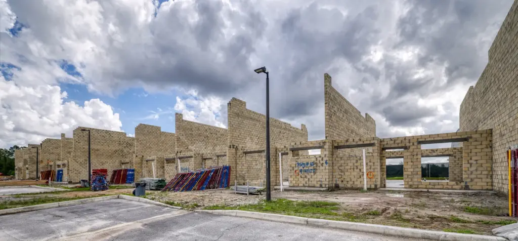 Dozens of Magic Village 3 townhomes have walls up and...