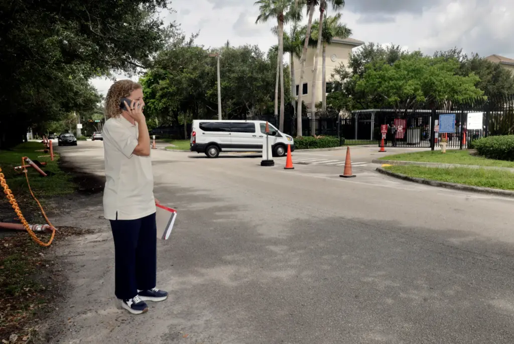 U.S. Rep. Debbie Wasserman Schultz talks on the phone outside...