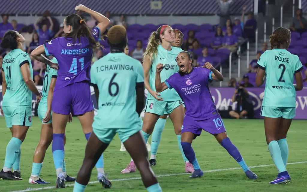 Orlando players Marta (10) and Hannah Anderson (41) celebrate after...