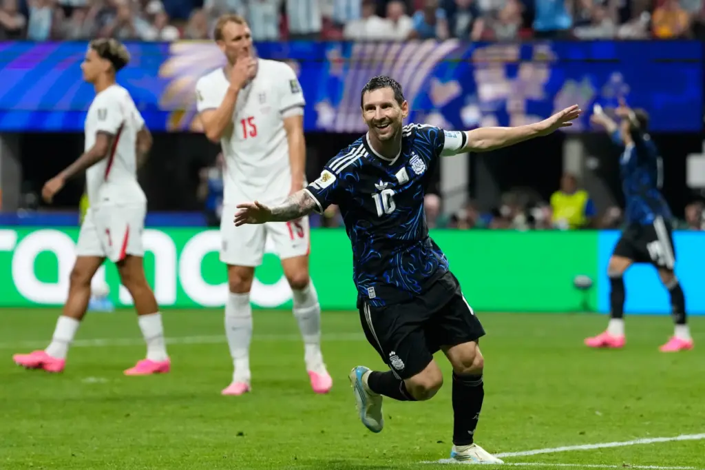 Argentina’s Lionel Messi celebrates after Enzo Fernandez scored their side’s...