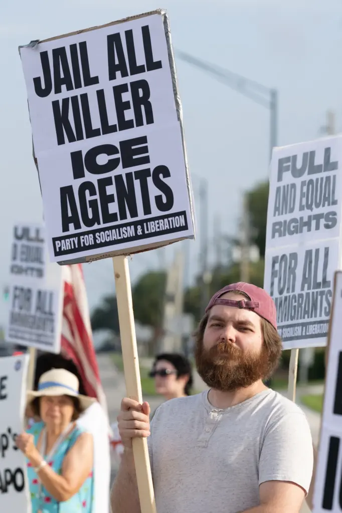 Protester holds a sign during the Stop Ice Terror National...