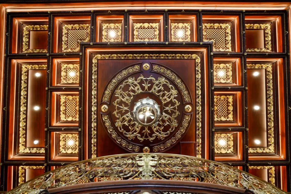 Artisan woodwork and carved columns frame an intimate reception area...