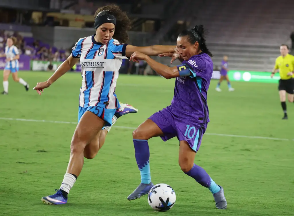 Orlando player Marta (10) and Chicago player Aaliyah Farmer (left)...