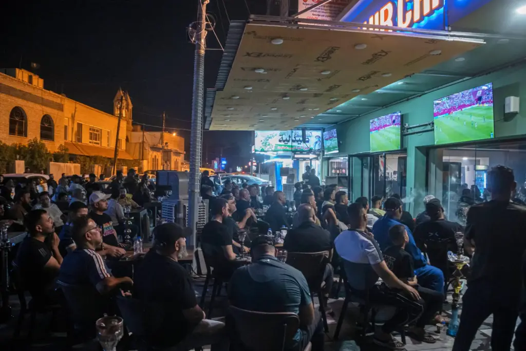 Soccer fans watch the World Cup Group I match between...