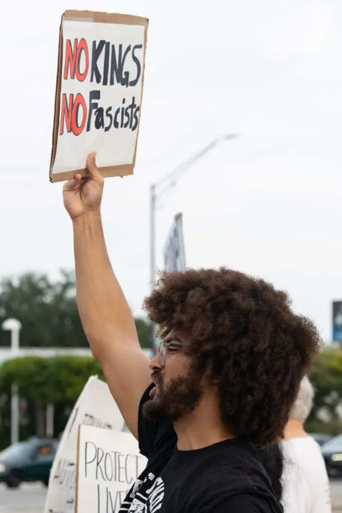 Protester holds a sign during the Stop Ice Terror National...